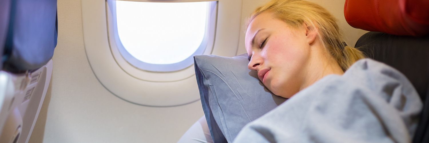 sleep on plane_395017804
